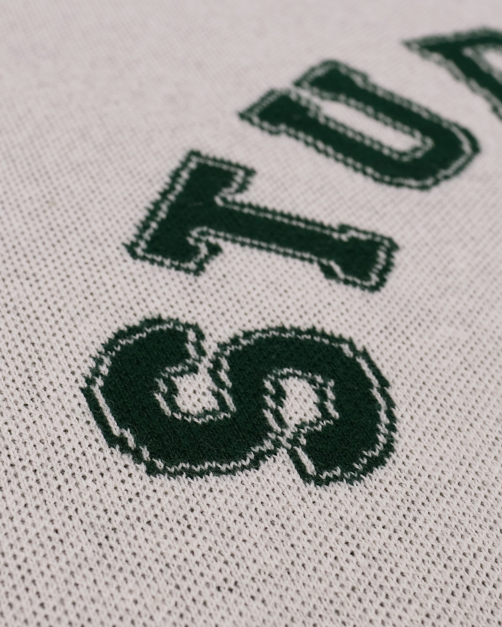 Close-up of a logo with 'STUDENTS' text on a textured background