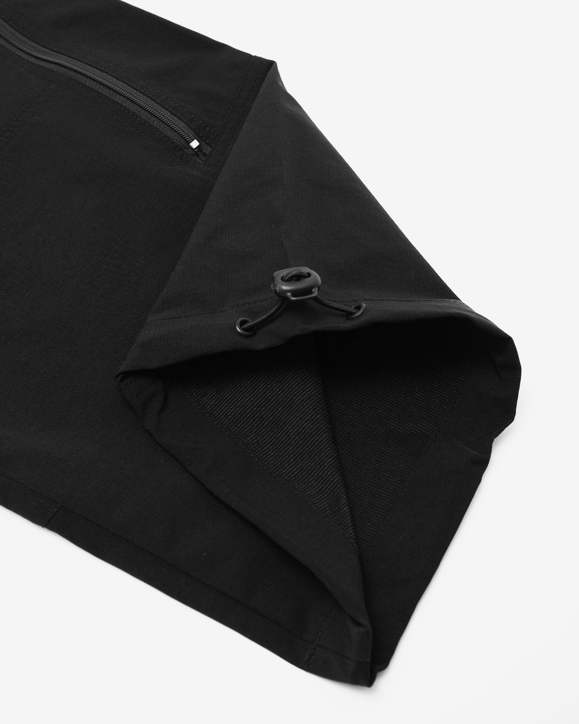 Black fabric with a zipper on a white background
