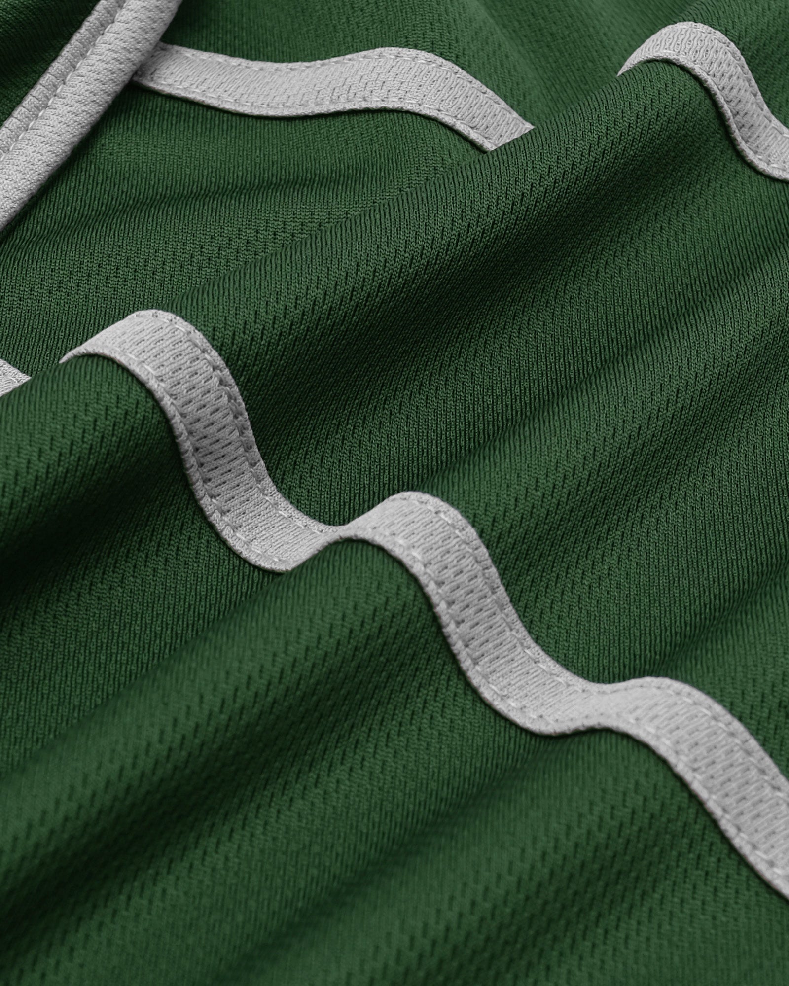 Close-up of green fabric with white wavy patterns
