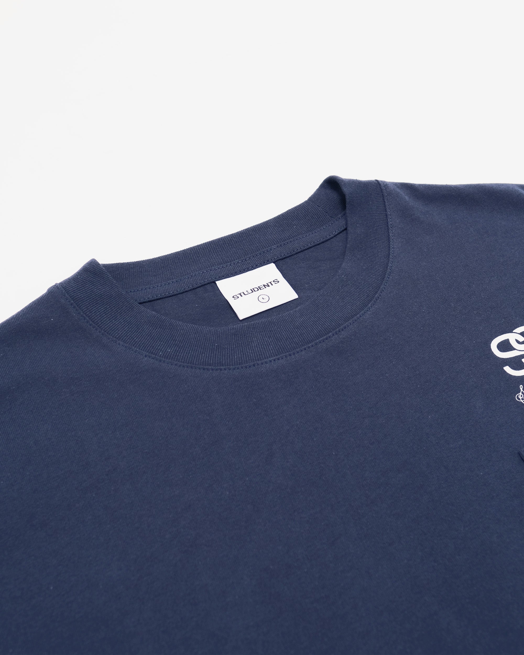 Navy blue t-shirt with a small white logo on a light gray background