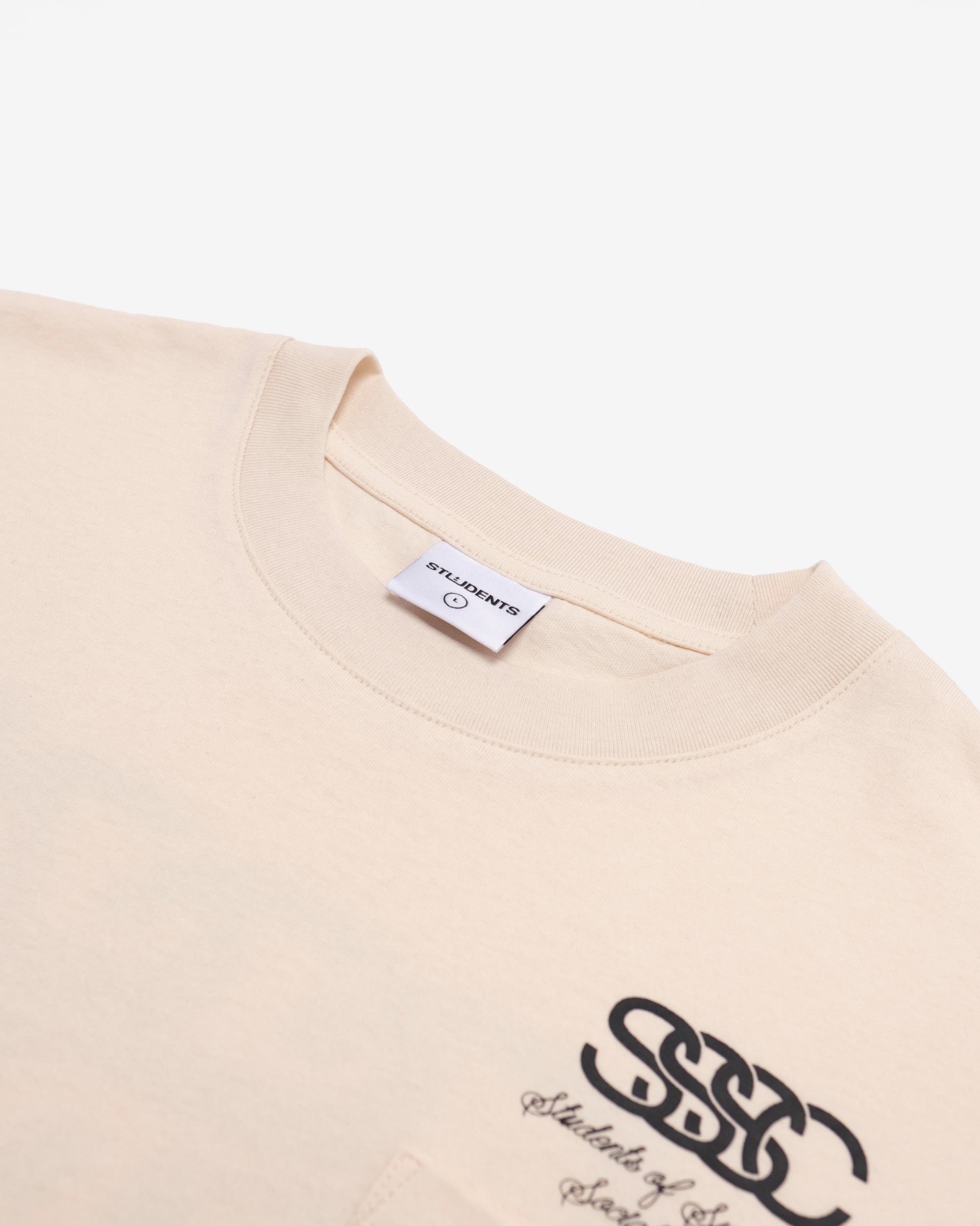 Beige t-shirt with a logo and brand label on a white background