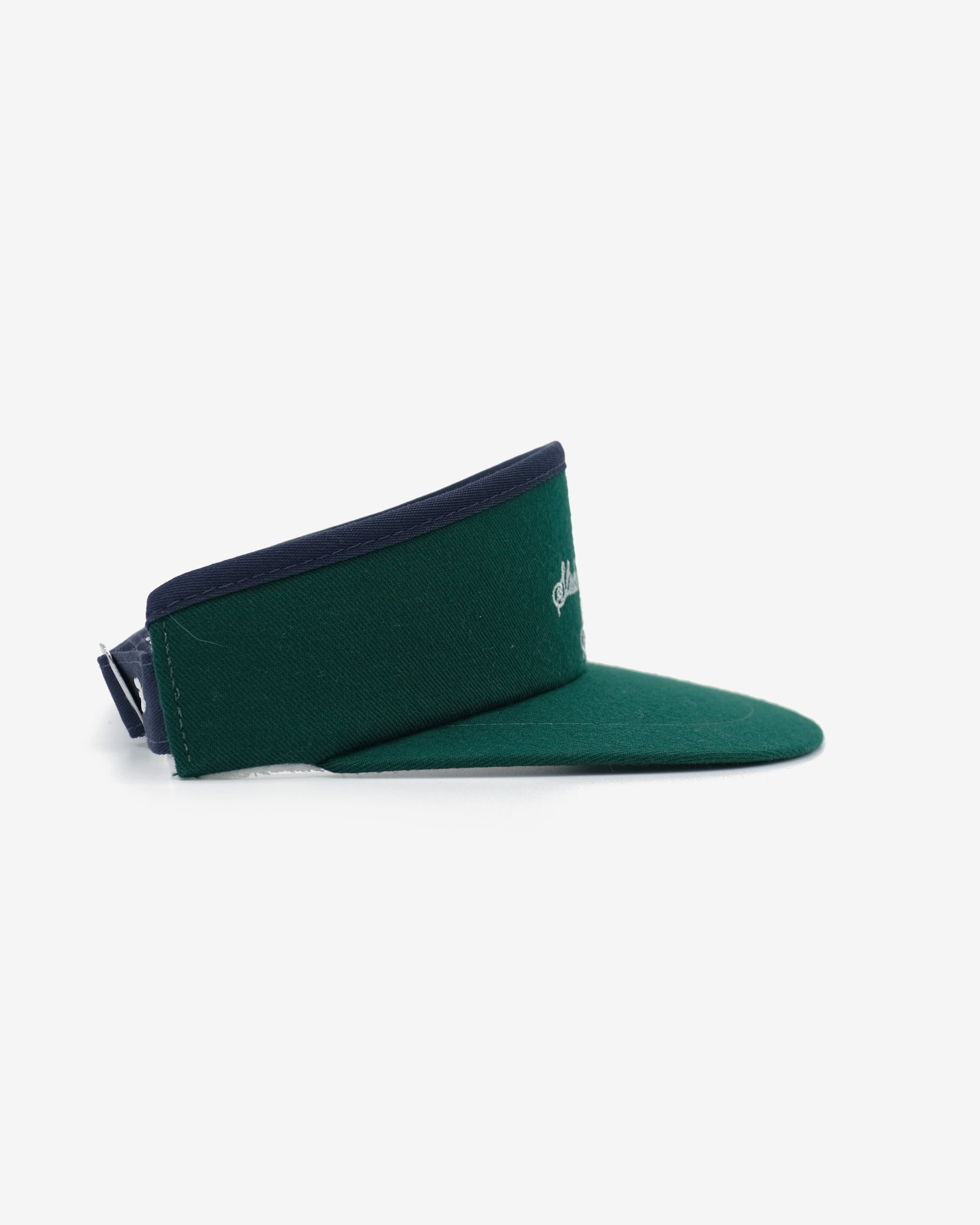 Green visor with navy band on a white background