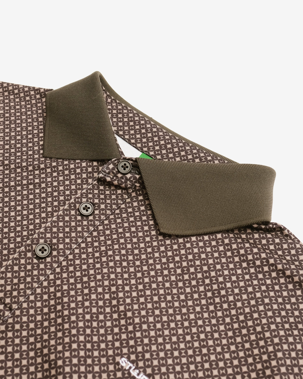 Close-up of a patterned polo shirt with a collar on a white background
