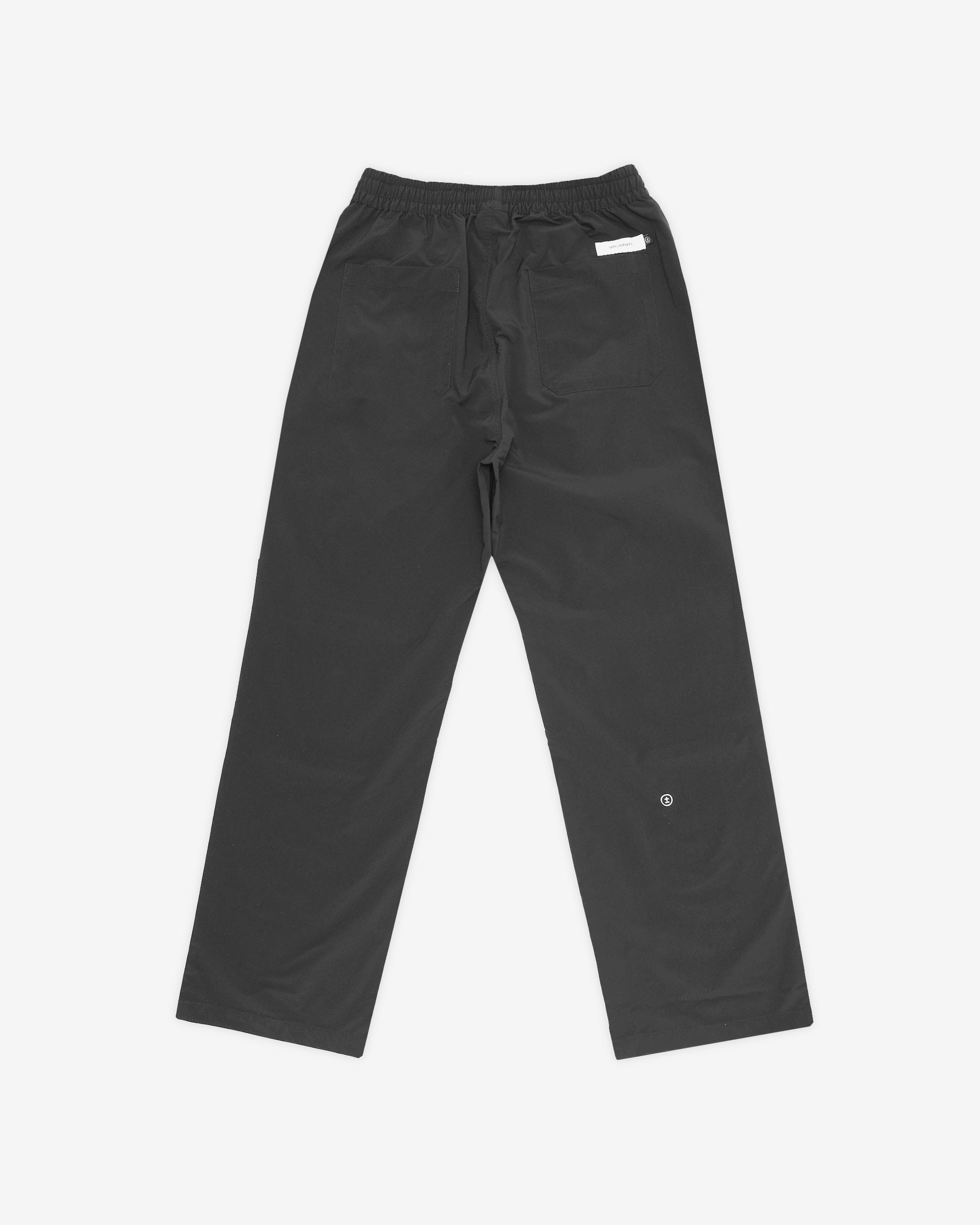 Black pants with a white label on a white background