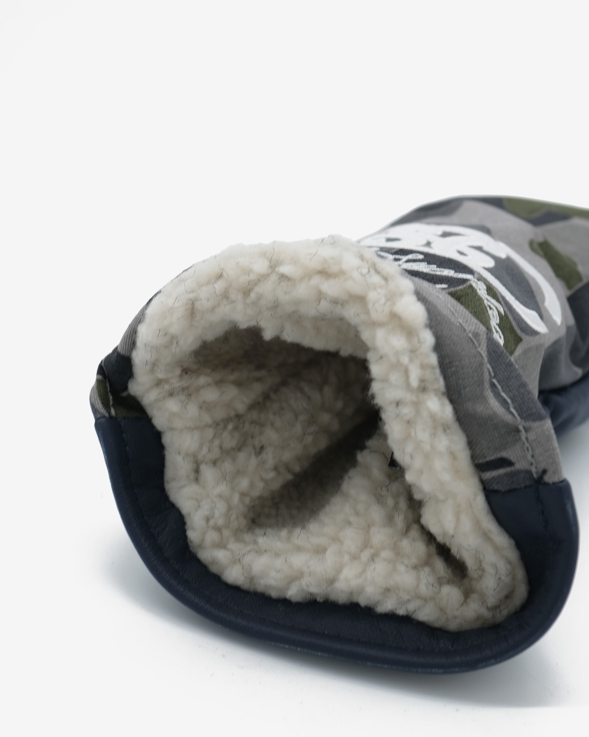 Golf club cover on a white background