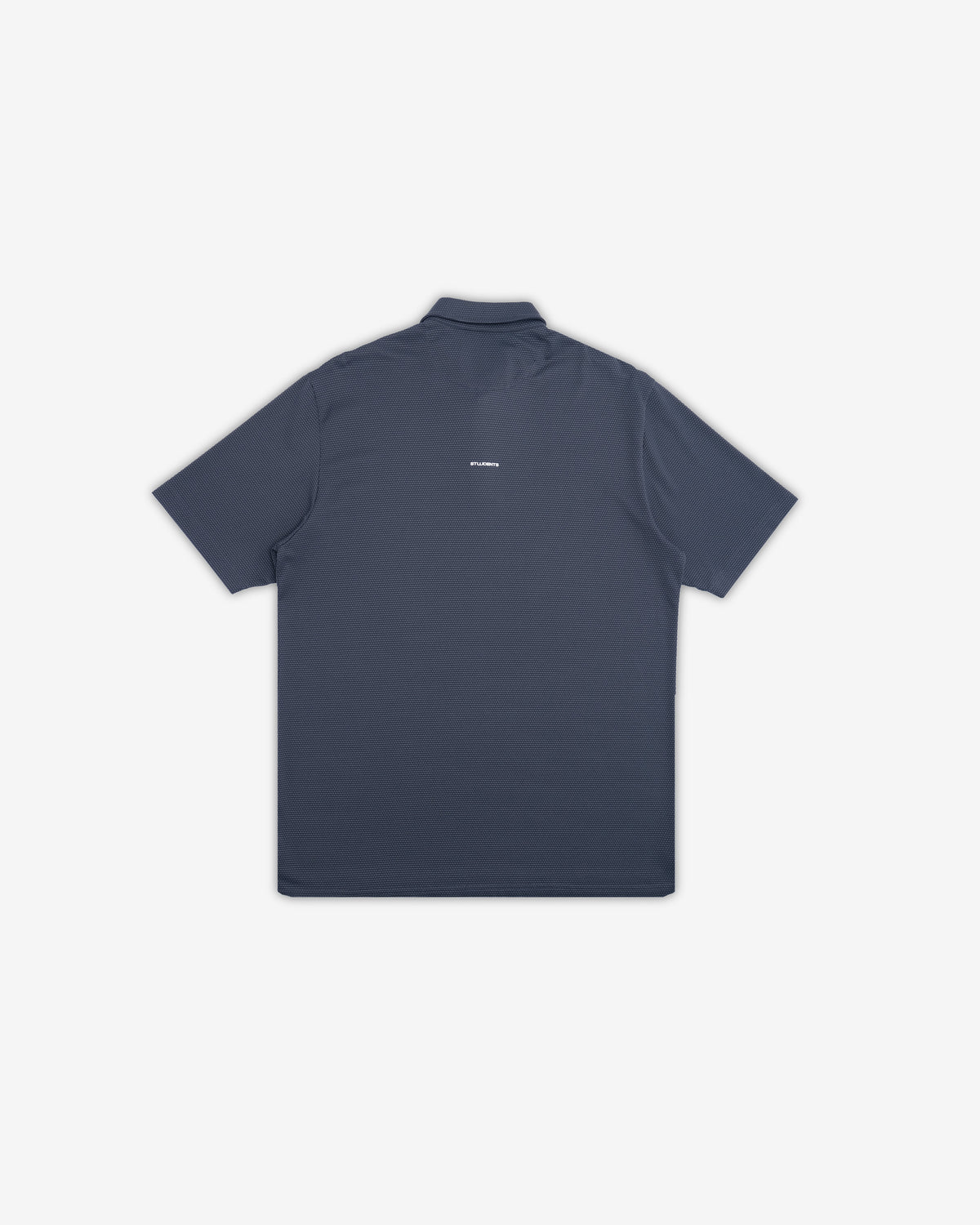 A dark slate blue short-sleeve polo shirt shown from the back, featuring a small white logo on the upper back, set against a plain light gray background.